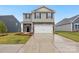 Two-story home with stone and siding exterior, two car garage at 8048 Plymouth Rd, Sherrills Ford, NC 28673