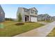 Two-story home with stone and siding exterior, two car garage at 8048 Plymouth Rd, Sherrills Ford, NC 28673