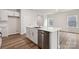 Modern kitchen with island, stainless steel appliances, and white cabinets at 8048 Plymouth Rd, Sherrills Ford, NC 28673