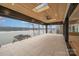 Spacious deck with lake views and glass railings at 8092 Edgewater Dr, Norwood, NC 28128