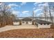 Modern lakefront home with attached two-car garage at 8092 Edgewater Dr, Norwood, NC 28128