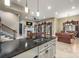 Basement kitchen island with granite countertop and sink at 8128 Bayview Ln, Belmont, NC 28012