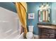 Bathroom with a tub, toilet and dark wood vanity at 8128 Bayview Ln, Belmont, NC 28012