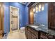 Bathroom with dark wood vanity and a walk-in shower at 8128 Bayview Ln, Belmont, NC 28012