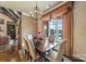 Elegant dining room with lake view and chandelier at 8128 Bayview Ln, Belmont, NC 28012