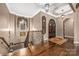 Grand entryway with hardwood floors and wrought iron railing at 8128 Bayview Ln, Belmont, NC 28012