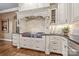 Well-equipped kitchen with professional range, custom cabinetry, and stone backsplash at 8128 Bayview Ln, Belmont, NC 28012