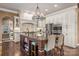 Gourmet kitchen with custom cabinetry, granite island, and high-end appliances at 8128 Bayview Ln, Belmont, NC 28012