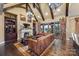 Spacious living room with vaulted ceilings, a fireplace, and leather furniture at 8128 Bayview Ln, Belmont, NC 28012