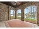 Stone porch overlooking a lake with wooden arbor at 8128 Bayview Ln, Belmont, NC 28012