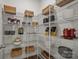 Walk-in pantry with multiple shelves provides ample storage for food and kitchen items at 820 Regulus Ct, York, SC 29745