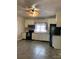 Updated kitchen with white cabinets and tile floors at 907 Sioux St, Monroe, NC 28110