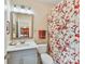 Charming bathroom featuring a decorative shower curtain, bright vanity, and a large mirror at 9730 Briarwick Ln, Charlotte, NC 28277