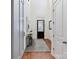 Bright and modern foyer with hardwood floors, a decorative console table, and a tall ceiling at 9730 Briarwick Ln, Charlotte, NC 28277