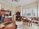 Bright home office with built-in shelves, a cozy window seat, and ample natural light at 9730 Briarwick Ln, Charlotte, NC 28277