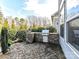 Brick outdoor grill area on a stone patio perfect for outdoor cooking and entertaining near the main house at 9730 Briarwick Ln, Charlotte, NC 28277