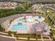 Aerial view of a community pool with slides, lap lanes, and well-maintained landscaping at 1008 Marquis Hills Dr # Mas0106, Fort Mill, SC 29715