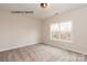 Cozy bedroom with neutral tones, a large window, and soft carpeting at 1008 Marquis Hills Dr # Mas0106, Fort Mill, SC 29715