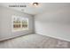 Bright bedroom features a large window providing ample natural light at 1008 Marquis Hills Dr # Mas0106, Fort Mill, SC 29715