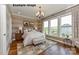 Inviting bedroom with large windows, hardwood floors, and decorative lighting at 1008 Marquis Hills Dr # Mas0106, Fort Mill, SC 29715