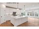 Modern kitchen featuring a large island, stainless steel appliances, and beautiful lighting at 1008 Marquis Hills Dr # Mas0106, Fort Mill, SC 29715