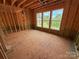 Spacious living room shows ample natural light streaming through three large windows at 1008 Marquis Hills Dr # Mas0106, Fort Mill, SC 29715
