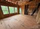 Spacious living room shows ample natural light streaming through three large windows at 1008 Marquis Hills Dr # Mas0106, Fort Mill, SC 29715