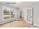 Bright home office with hardwood floors, large windows, and stylish double glass doors to a secondary room at 1008 Marquis Hills Dr # Mas0106, Fort Mill, SC 29715
