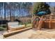 Backyard with a hot tub, deck, and stairs leading down to a patio area at 1016 Antioch Woods Ln # 36, Weddington, NC 28104