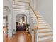 Foyer with staircase, wood floors, and view into the living room at 1016 Antioch Woods Ln # 36, Weddington, NC 28104