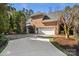 Spacious three-car garage with a concrete driveway surrounded by manicured landscaping at 1016 Antioch Woods Ln # 36, Weddington, NC 28104