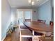 Dining area with wood floors and patio access at 10386 Turnplow Dr, Davidson, NC 28036