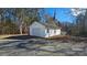 Detached white single car garage with single door at 10386 Turnplow Dr, Davidson, NC 28036