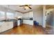 Galley kitchen with stainless steel appliances and white cabinets at 10386 Turnplow Dr, Davidson, NC 28036