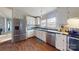 Kitchen boasts stainless steel appliances and white cabinets at 10386 Turnplow Dr, Davidson, NC 28036