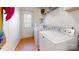 Convenient laundry room with washer, dryer, and exterior access at 10386 Turnplow Dr, Davidson, NC 28036