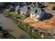 Aerial view of a new home with water feature and surrounding houses at 1057 12Th Avenue Nw Dr, Hickory, NC 28601