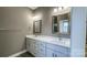 Double vanity bathroom with white cabinets and quartz countertops at 1057 12Th Avenue Nw Dr, Hickory, NC 28601