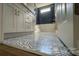 Bathroom with patterned floor and white vanity at 1057 12Th Avenue Nw Dr, Hickory, NC 28601