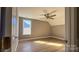 Spacious bedroom with large window and ceiling fan at 1057 12Th Avenue Nw Dr, Hickory, NC 28601