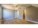 Spacious bedroom featuring ceiling fan and hardwood floors at 1057 12Th Avenue Nw Dr, Hickory, NC 28601