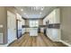 Modern kitchen with white cabinets, quartz countertops, and a kitchen island at 1057 12Th Avenue Nw Dr, Hickory, NC 28601