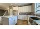 Modern kitchen with white cabinets, stainless steel appliances, and a farmhouse sink at 1057 12Th Avenue Nw Dr, Hickory, NC 28601