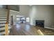 Open living area with fireplace and kitchen view at 1057 12Th Avenue Nw Dr, Hickory, NC 28601