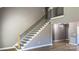 Modern staircase with metal railing and wooden steps at 1057 12Th Avenue Nw Dr, Hickory, NC 28601