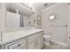 Bathroom with a modern sink, stylish tile floor, and framed mirror at 11400 Five Cedars Rd, Charlotte, NC 28226