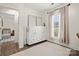 Bright bedroom featuring a murphy bed, soft light, and pleasant decor at 11400 Five Cedars Rd, Charlotte, NC 28226