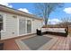 Inviting deck features outdoor seating and sliding glass doors, perfect for relaxing and entertaining at 11400 Five Cedars Rd, Charlotte, NC 28226