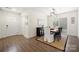 Dining room with modern lighting, a table for six, and sliding glass doors at 11400 Five Cedars Rd, Charlotte, NC 28226