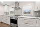 Kitchen features stainless steel appliances, modern cabinets, and grey subway tile backsplash at 11400 Five Cedars Rd, Charlotte, NC 28226